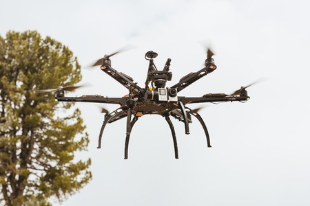Professional sextacopter dron copter flies in airの写真素材