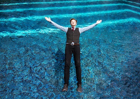 Man falls to swimming pool. Business safety conceptの写真素材