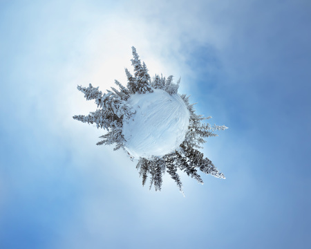Little planet panorama with snowy trees on Zelenaya mountain in Sherehesh resort. Siberia, Russiaの写真素材