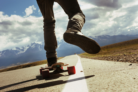 Man rides on the long board. Travel conceptの写真素材