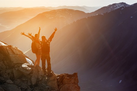 Happy couple winner mountain top conceptの写真素材
