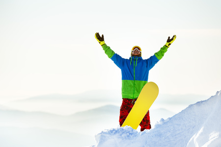 Happy snowboarder snowboard mountain topの写真素材