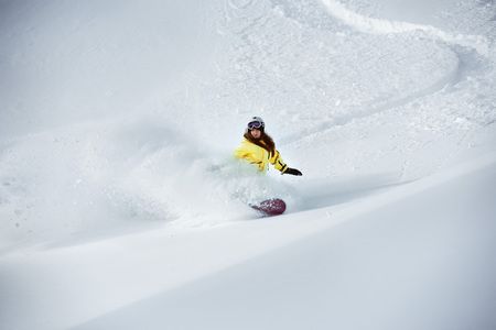 Girl snowboarder off-piste backcountry freeridingの写真素材