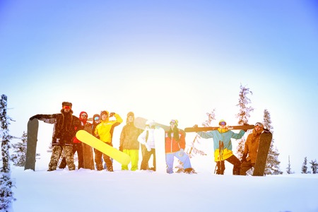Group friends skiing snowboarding resortの写真素材