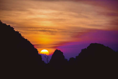 Beautiful sunrise or sunset in mountains. Phangnga province, Thailand. Space for textの写真素材