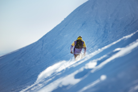 Snowboarding concept with offpiste backcountry snowboarder or skierの写真素材