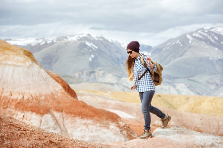 Girl hiker walking red mountains