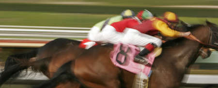Slow shutter speed rendering of racing jockeys and horses.の写真素材