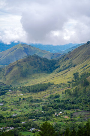 Scenic view of lake toba from Samosir in North Sumatra, Indonesia againts mountain and skyの写真素材