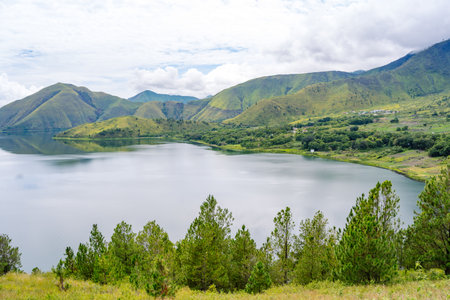 Scenic view of lake toba from Samosir in North Sumatra, Indonesia againts mountain and skyの写真素材