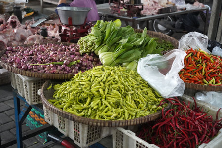 Assorted fresh vegetables sold in plastic tray at traditional marketplace in Ungaran, Indonesia. Street Photographyの写真素材