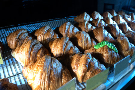 Close up of Freshly baked croissant on stainless steel tray. Food Photography.の写真素材