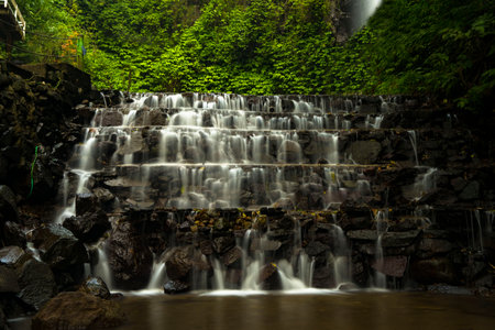 Landscape of multilevel waterfalls in Dlundung, Trawas, Mojokerto. Indonesia. Long Exposure Nature Photography.の写真素材