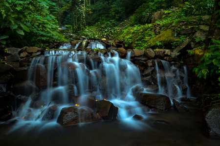 Landscape of multilevel waterfalls in Dlundung, Trawas, Mojokerto. Indonesia. Long Exposure Nature Photography.の写真素材