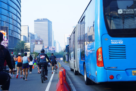 July 23, 2023. Jakarta, Indonesia. Car Free Day, A joyous urban escape where the bustling metropolis takes a collective breath of fresh air. On this special day, the city celebrates life's simple pleasures, with its streets filled with laughter, vibrant sのeditorial素材