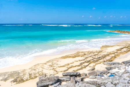 Pandawa Beach, Bali. Stunning white sand beach with turquoise waters, surrounded by towering limestone cliffs. A tropical paradise awaitsの写真素材