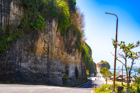 Padawa Beach cliff towers majestically over the ocean, showcasing nature's beauty and power. A breathtaking sight that inspires awe and wonder.の写真素材