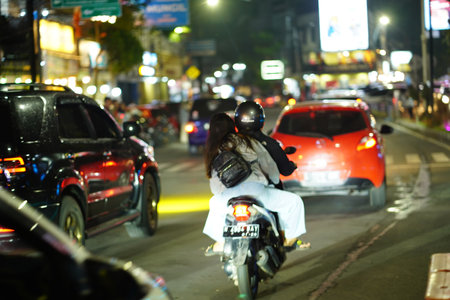 December 9, 2023. Batu City, East Java, Indonesia. The night life on the street of the city with...