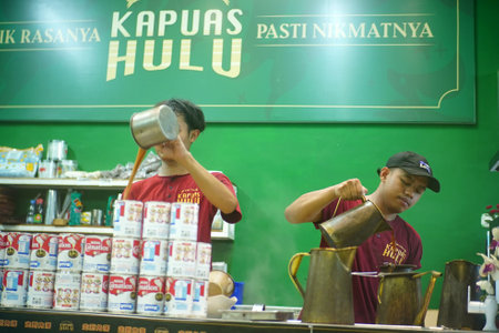 January 2, 2024. Surabaya, East Java, Indonesia. Baristas at the kopi tiam or Chinese Indonesian...