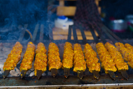 Skewers of shish kebab and chicken cooked on a grill near Ampel area in Surabaya, Indonesia. Street Food Photography.の写真素材