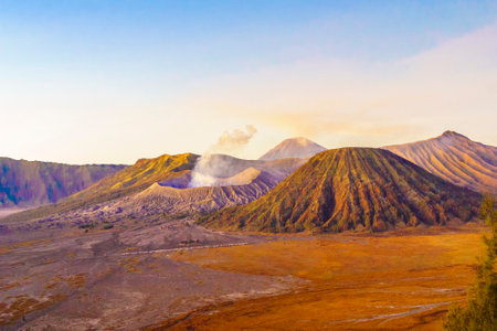 Dramatic sunrise over Mount Bromo, showcasing its volcanic cone and vast sand sea, creating a breathtaking landscape.の写真素材