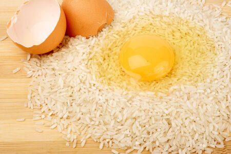 Broken egg and riceの写真素材