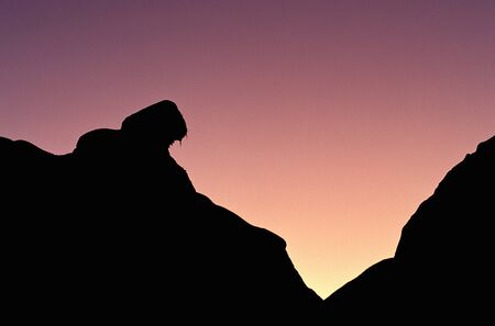 Silhoutte of rocks at sunsetの写真素材