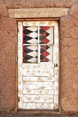 Decorated Door and Adobe Building, Taos Puebloのeditorial素材