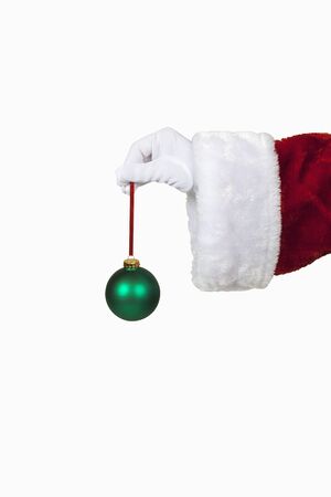 Santa holding a christmas ornamentの写真素材