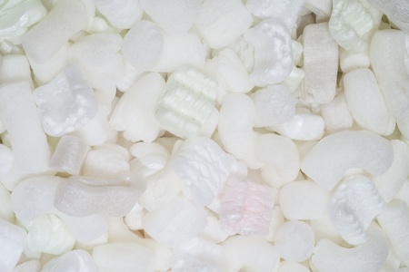 Styrofoam packing peanuts in shipping box, studio shotの写真素材