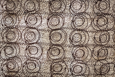 Rusted bedsprings leaning against wall, Utahの写真素材