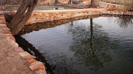 Pond full of collected, natural spring water at Pipe Spring National Monumentの写真素材