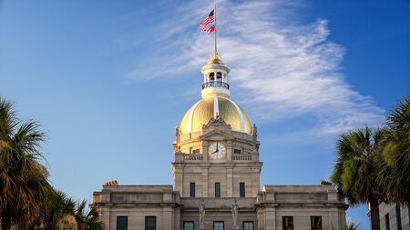 American and Georgia state flags on top of golden dome of City Hall in Savannah, Georgiaのeditorial素材