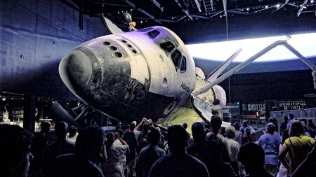 CAPE CANAVERAL, FLORIDA - JUNE 14th: A crowd of visitors view the space shuttle Atlantis at the...