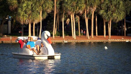 ORLANDO, FLORIDA - MAY 21st: Tourists in paddle boat at Lake Eola Park in Orlando, Florida on May 21st, 2016.のeditorial素材