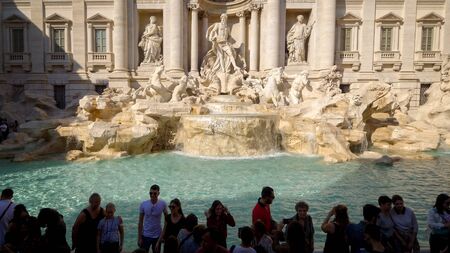 Trevi Fountain in Rome is one of Italys most famous landmarks and often surrounded by touristsのeditorial素材