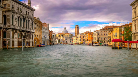 Venice, Italy boats and city skyline on the Grand Canal with San Geremia Church in backgroundの写真素材