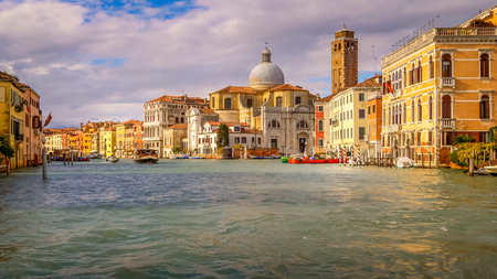 Venice, Italy boats and city skyline on the Grand Canal with San Geremia Church in backgroundの写真素材