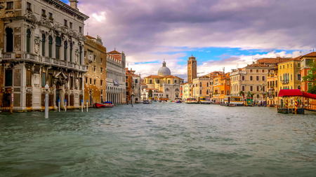 Venice, Italy boats and city skyline on the Grand Canal with San Geremia Church in backgroundの写真素材