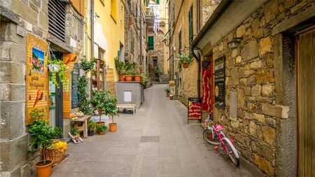 CORNIGLIA, ITALY - NOVEMBER 14th: A narrow alley with shops in the Cinque Terre village of Corniglia  in the province of La Spezia on November 14th, 2017のeditorial素材