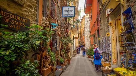 CORNIGLIA, ITALY - NOVEMBER 14th: A narrow alley with shops in the Cinque Terre village of Corniglia  in the province of La Spezia on November 14th, 2017のeditorial素材