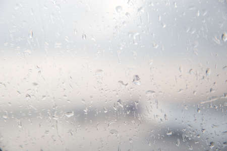 Blur Abstract background. Rain drops on the window.の写真素材