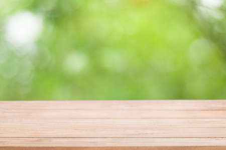 Wood table top on blur nature background, used for montage or display your productsの写真素材