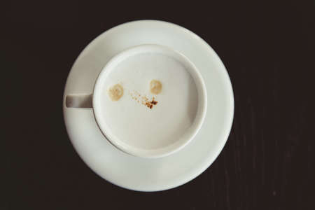 White aroma coffee cup, vintage concrete table background, top view,  drink.の写真素材