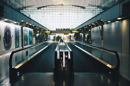The walk way in the terminal at the airport to the gate.