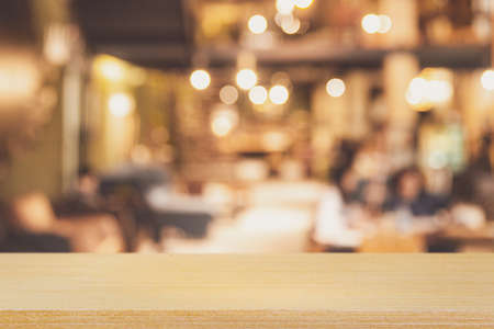 Empty Table top Counter with Blurred People and Restaurant, cafe, or coffee Shop. interior backgroundの写真素材