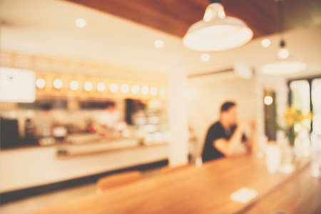 Blurred background made with Vintage Tones,Coffee shop blur background with bokeh light.の写真素材