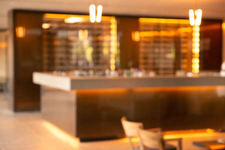 Blur abstract of bar counter in the hotel lounge or restaurant with bokeh lights in the day time.の写真素材
