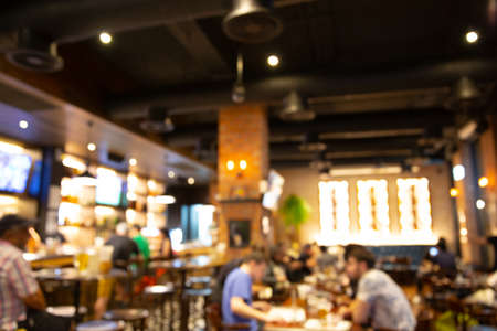 blur light in pub or bar and restaurant at night party background. Blurred background of restaurant with abstract bokeh light.の写真素材