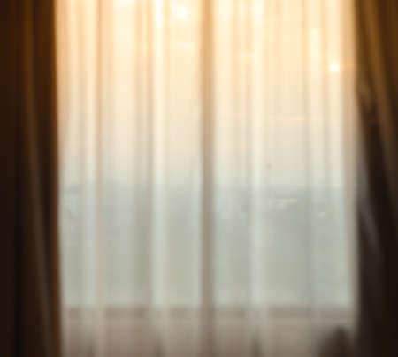 Defocused curtain window and stationery box with sunlight. For montage product display or design key visual layoutの写真素材
